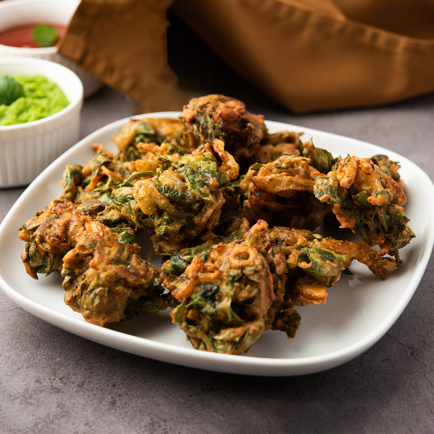 Spinach Firtters or Palak pakoda or pakora. Popular Indian tea-time snack
